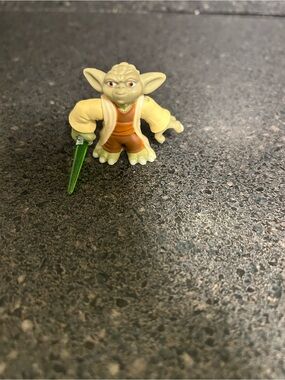 Small Yoda Figurine with Green Lightsaber